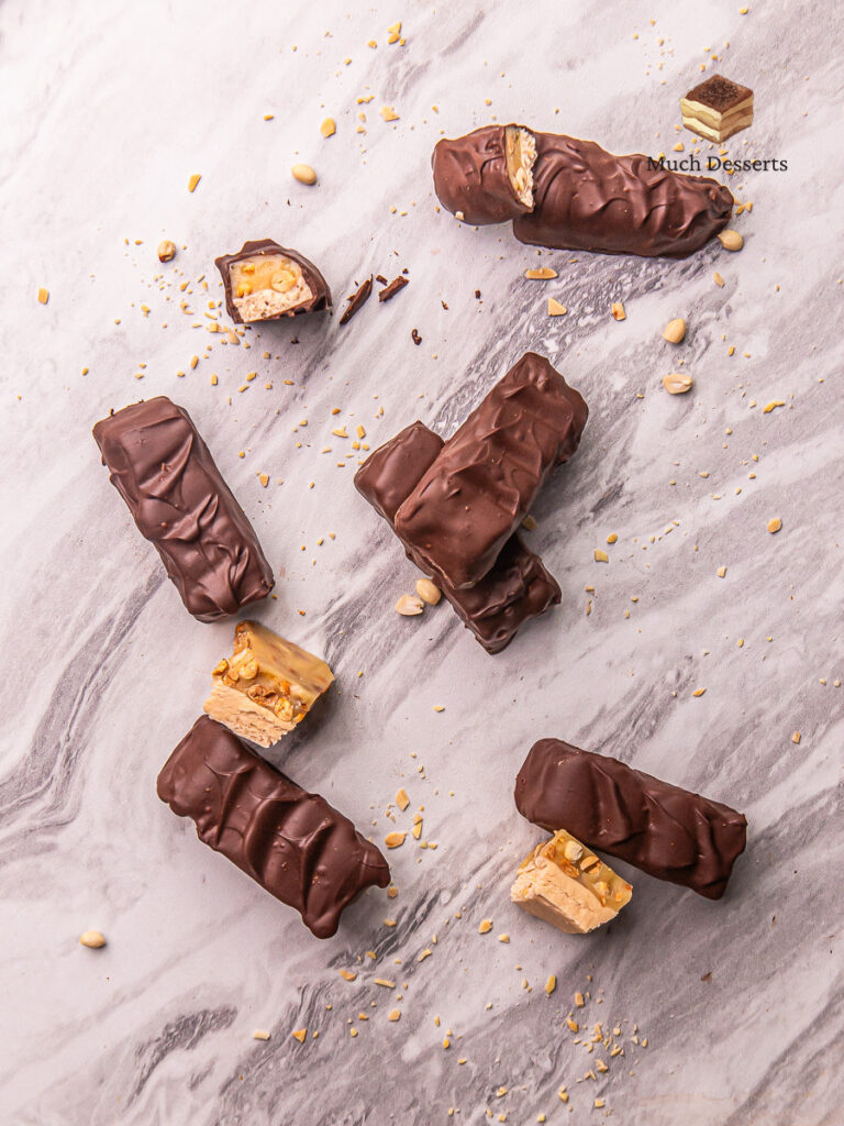 Craving a homemade Snickers bar? Our easy recipe delivers chewy nougat, crunchy peanuts, and caramel, all topped with semi-sweet chocolate.