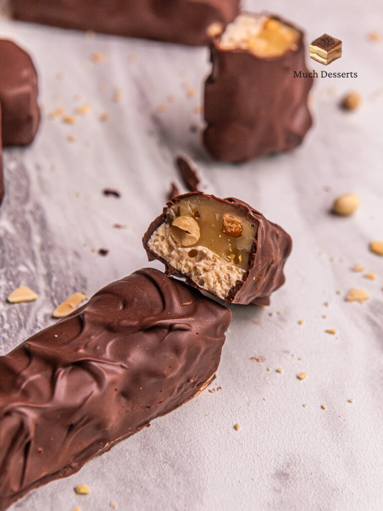 Craving a homemade Snickers bar? Our easy recipe delivers chewy nougat, crunchy peanuts, and caramel, all topped with semi-sweet chocolate.