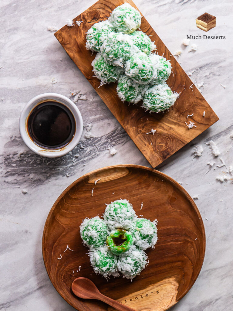 Klepon is a delicious twist on the Indonesian dessert, featuring pandan glutinous rice,coconut sugar filling, and coconut coating.
