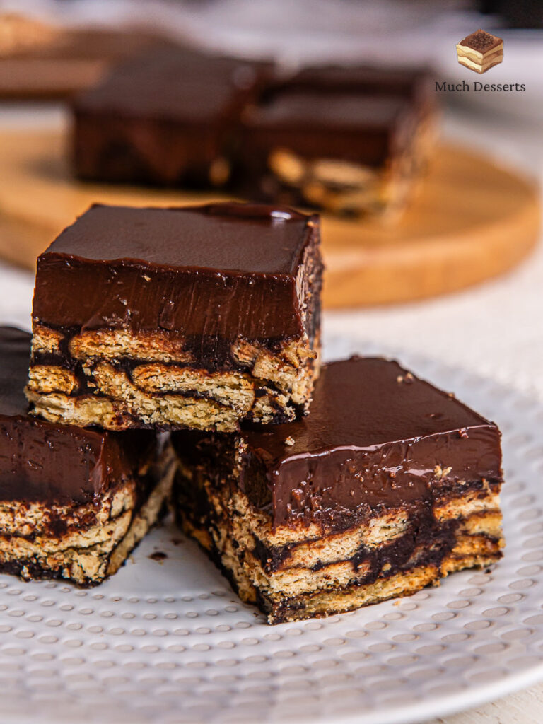 Make this super easy Malaysian kek batik with chocolate ganache. features layers of chocolate and biscuits, topped with a luscious chocolatey