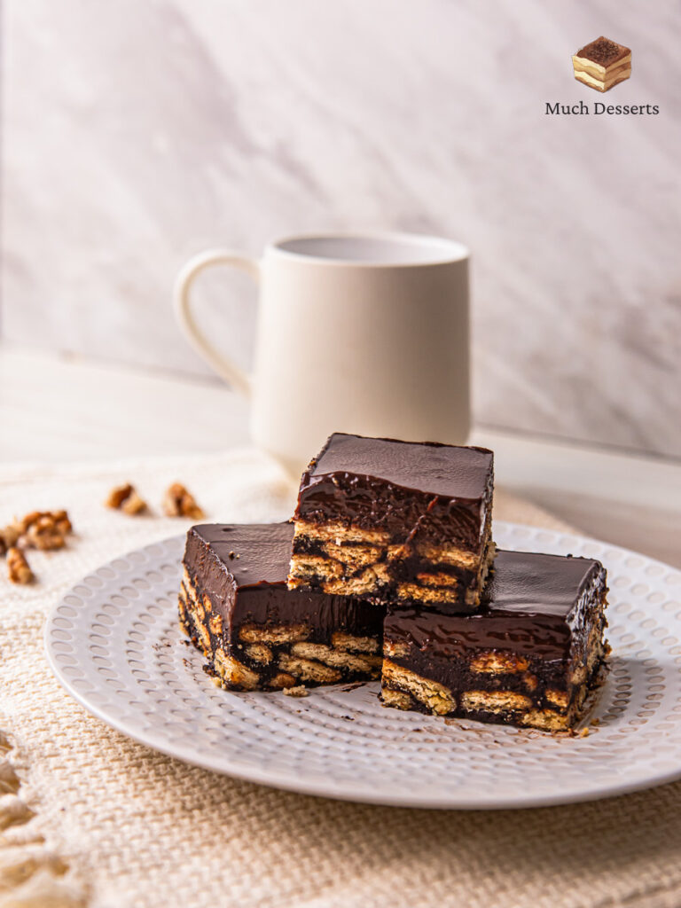 Make this super easy Malaysian kek batik with chocolate ganache. features layers of chocolate and biscuits, topped with a luscious chocolatey