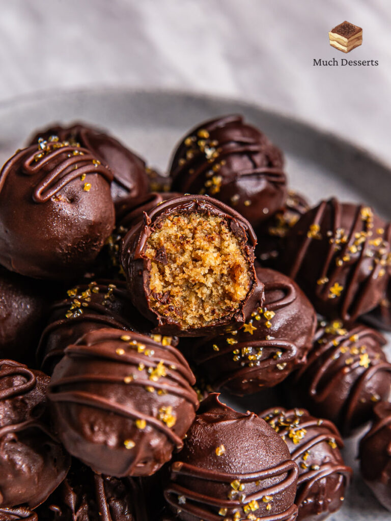 Tiramisu Truffles are mini tiramisu in the form of small balls by mixing cake crumbs, for example, using ladyfinger biscuits.